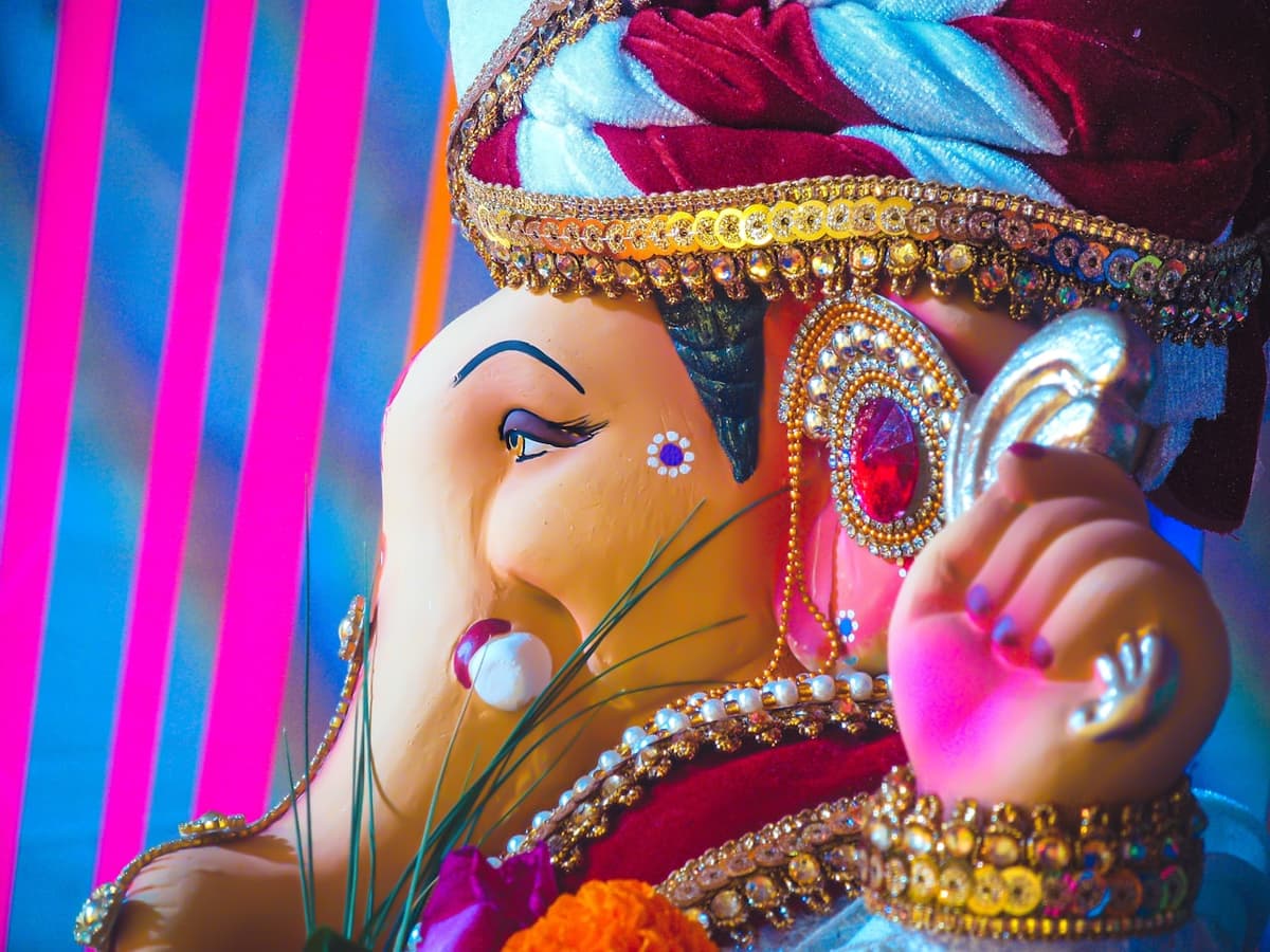 Ganesh Chaturthi celebrations with Lord Ganesha idol and pandal decorations